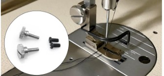 Needle clamp screw holds the needle in one place